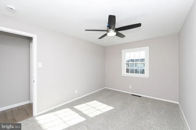 a view of a big room with carpet