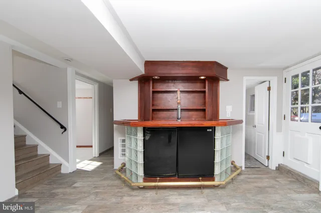 a room with fireplace and a wooden floor