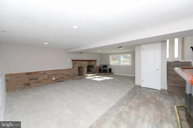 a view of kitchen and hall with wooden floor