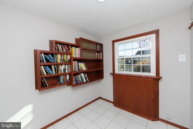 a room with bookshelf and a book shelf