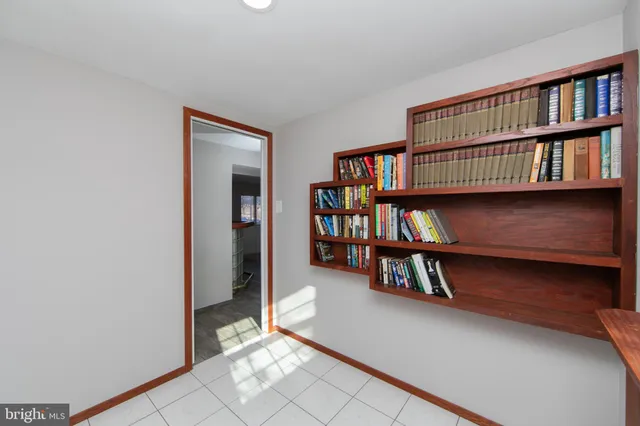 a book shelf with books and knick knacks on it