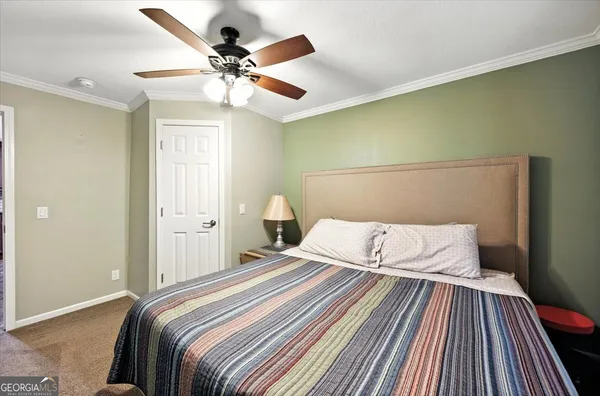 a bathroom with a granite countertop sink toilet a mirror and shower