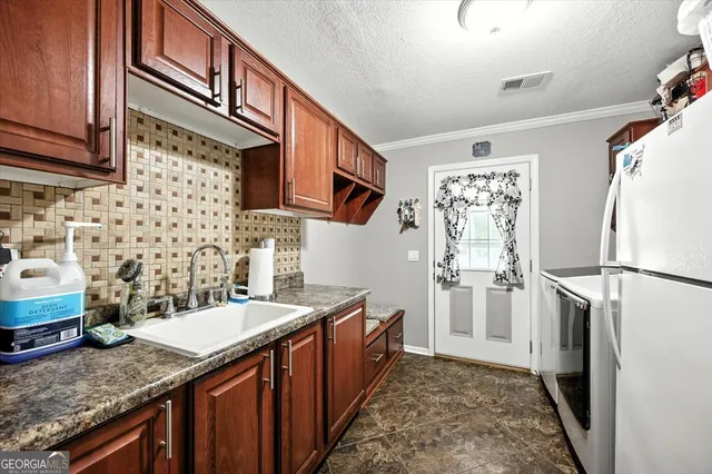 a view of a workspace with furniture and windows