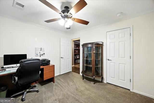 a view of a patio with table and chairs