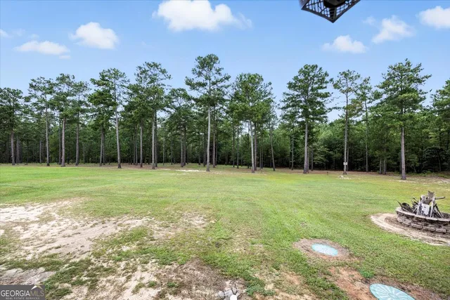 a bed sitting in a room next to a window