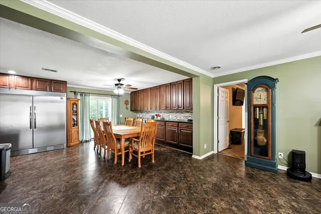 a view of a big room with wooden floor windows and cabinet