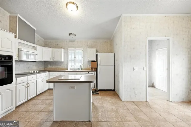 a view of a deck with wooden floor and fence with a yard
