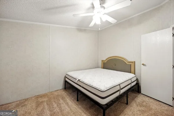 an aerial view of a house with yard swimming pool and outdoor seating