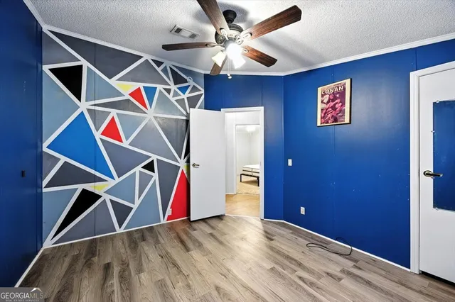 a view of a city with lush green forest