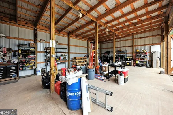 an aerial view of a house with swimming pool yard and outdoor seating