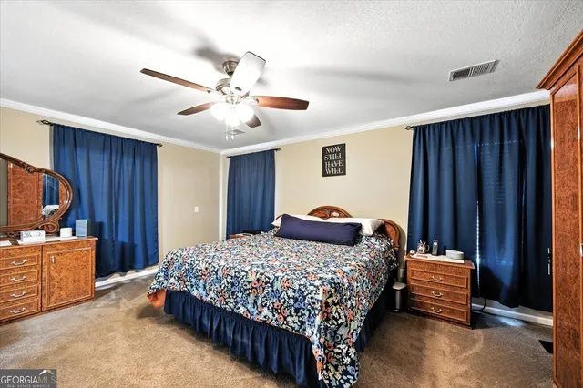 a bathroom with a double vanity sink a large mirror and a shower