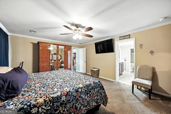 a kitchen with stainless steel appliances granite countertop wooden cabinets a refrigerator and a sink