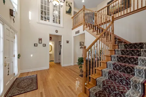 a view of entryway with wooden floor