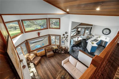 a large bedroom with bed and a window