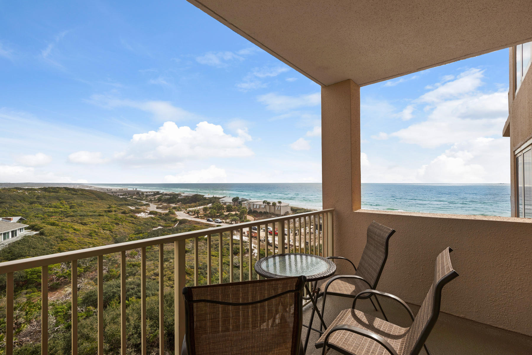 9011 Highway 98, Unit 701 Miramar Beach, FL 32550 - Photo 12 of 13 a view of a balcony with chair and ocean view