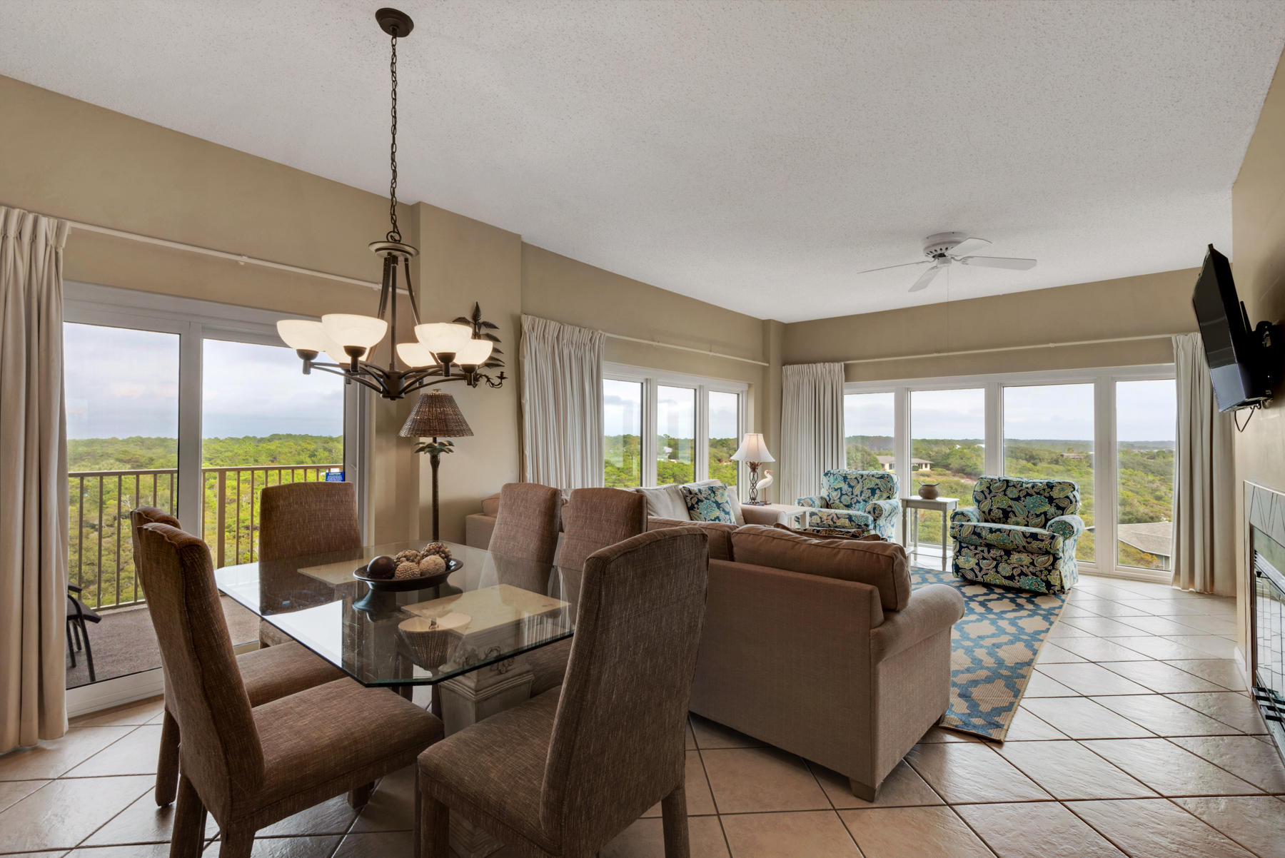 9011 Highway 98, Unit 701 Miramar Beach, FL 32550 - Photo 5 of 13 a view of a dining room and furniture a chandelier