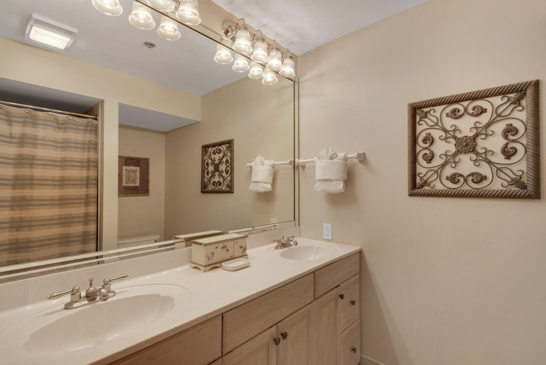 9011 Highway 98, Unit 701 Miramar Beach, FL 32550 - Photo 9 of 13 a bathroom with a double vanity sink mirror and double