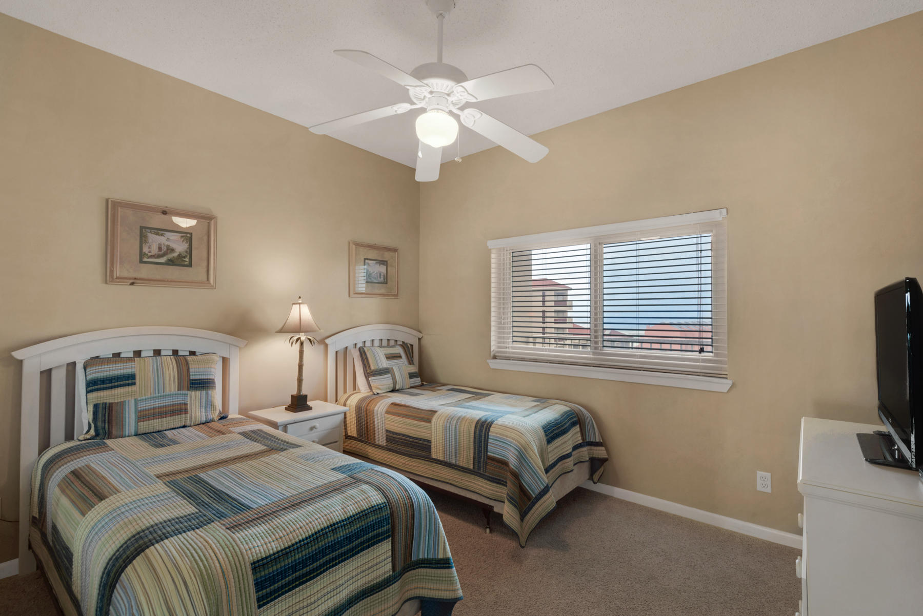 9011 Highway 98, Unit 701 Miramar Beach, FL 32550 - Photo 10 of 13 a bedroom with two beds and a flat screen tv