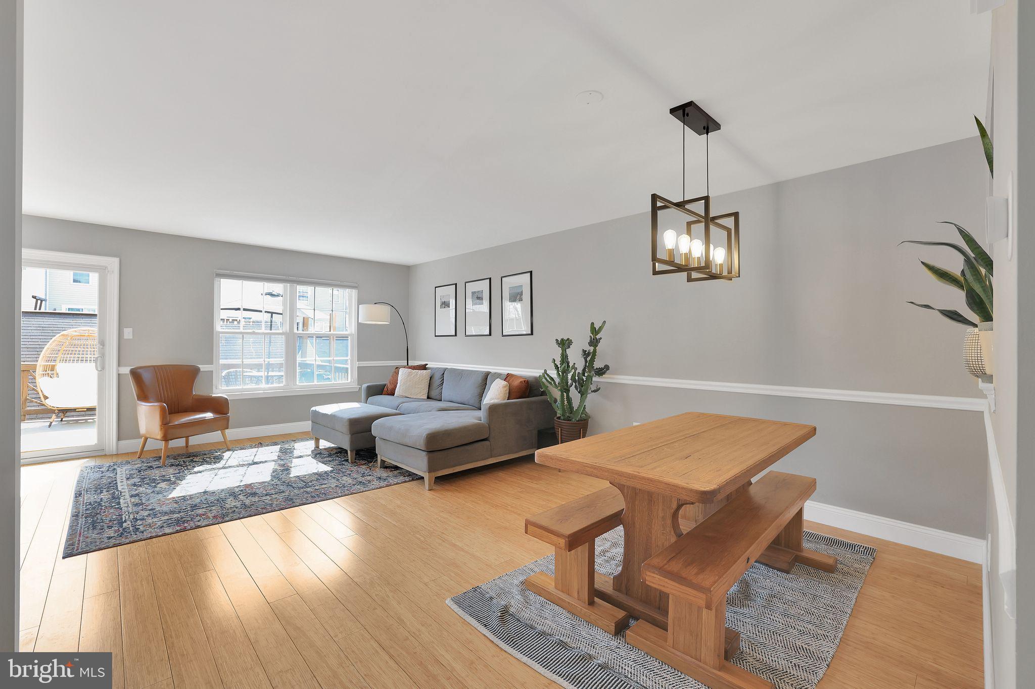 22952 Regent Terrace Sterling, VA 20166 - Photo 11 of 64 a living room with furniture and wooden floor