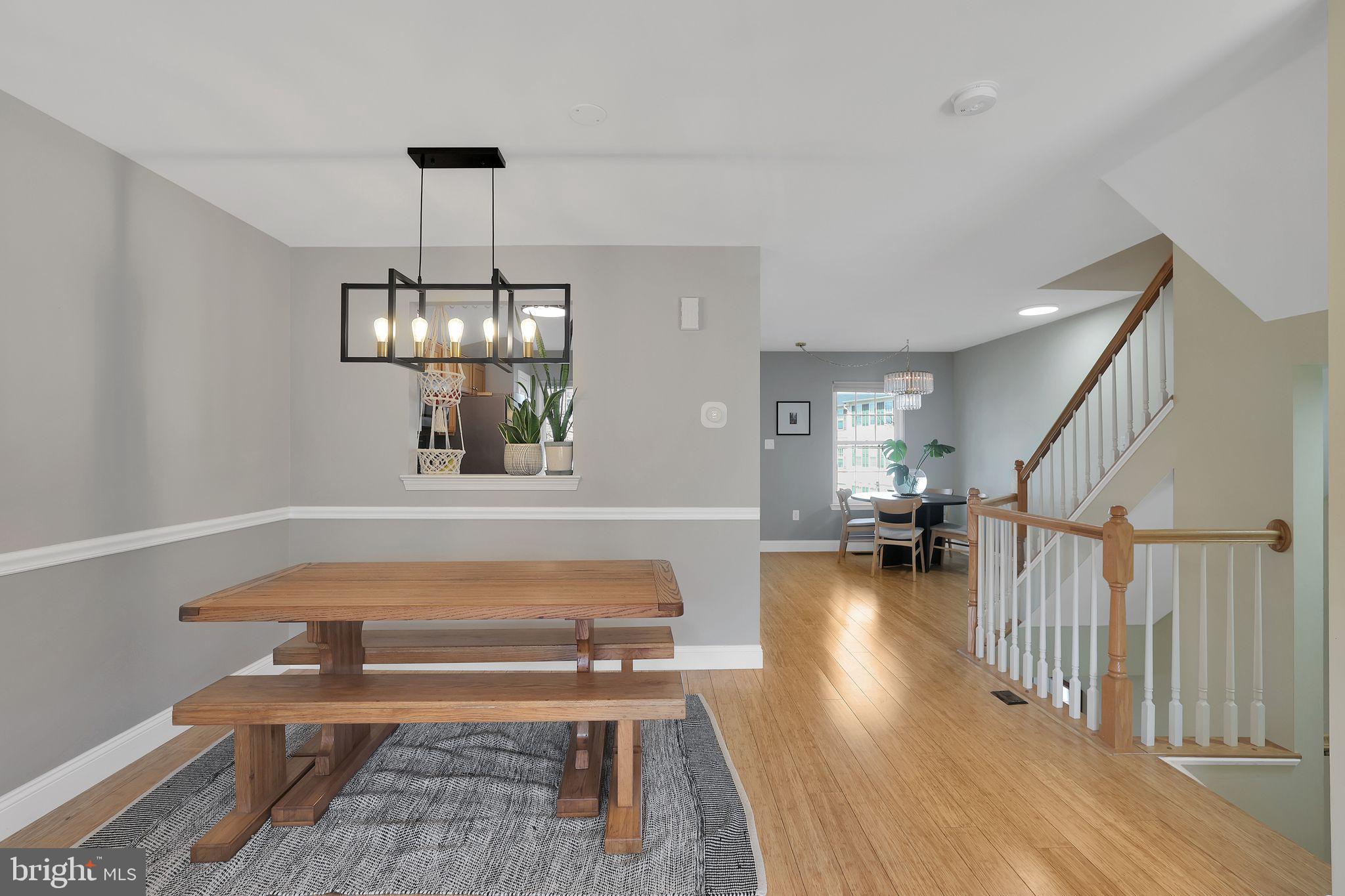 22952 Regent Terrace Sterling, VA 20166 - Photo 13 of 64 a living room with furniture and a chandelier