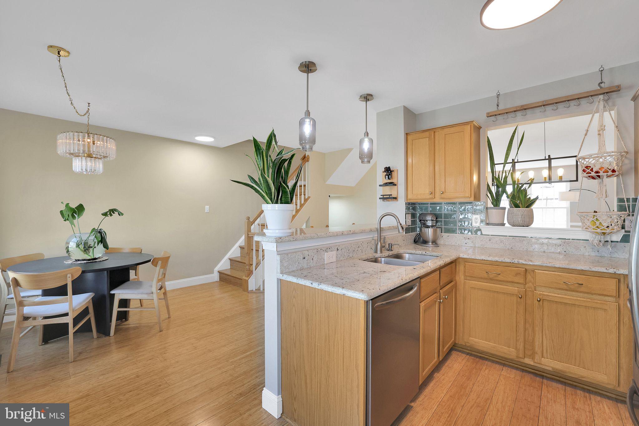 22952 Regent Terrace Sterling, VA 20166 - Photo 18 of 64 a kitchen with a sink and cabinets
