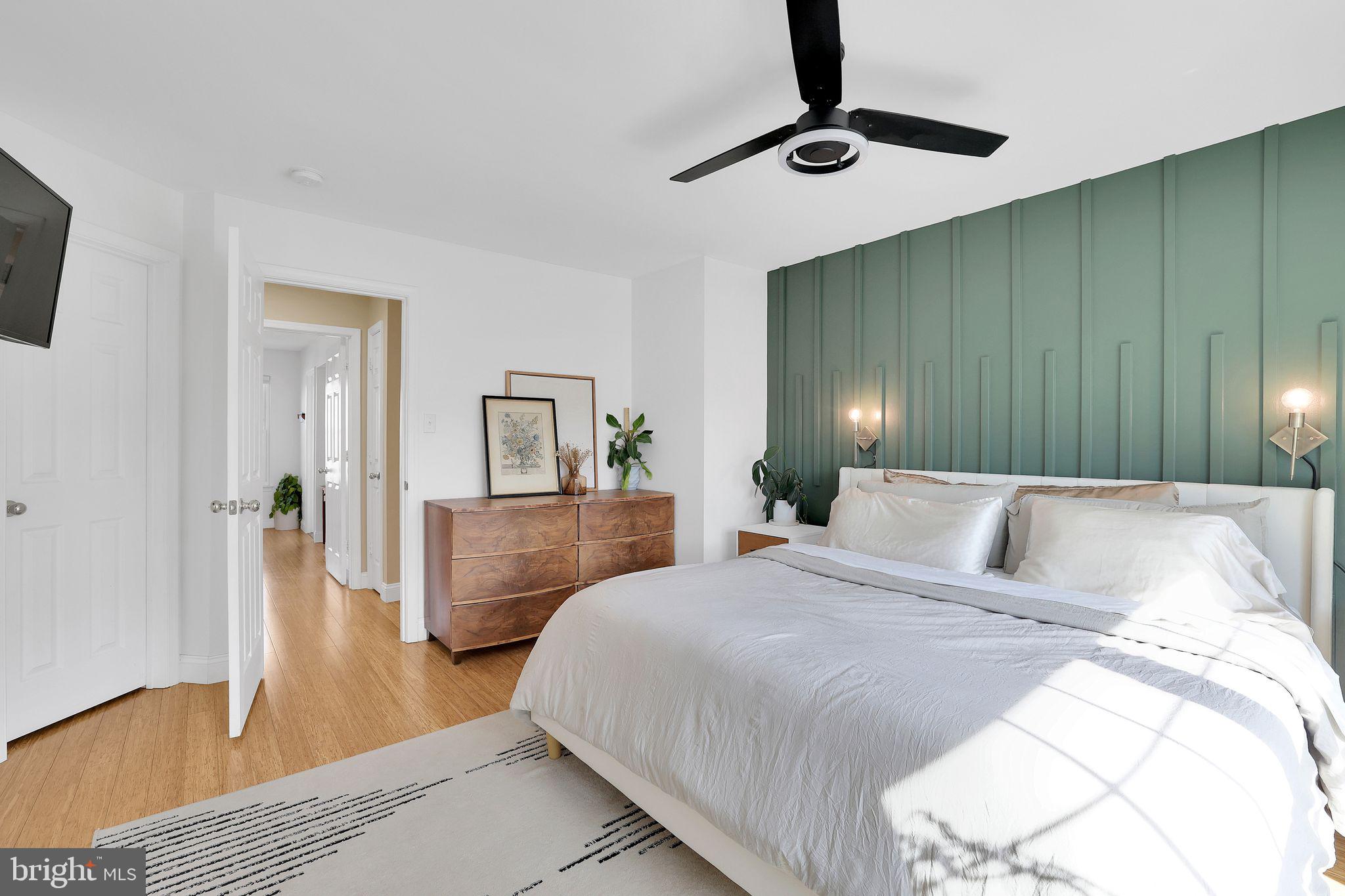 22952 Regent Terrace Sterling, VA 20166 - Photo 24 of 64 a bedroom with a bed and wooden floor