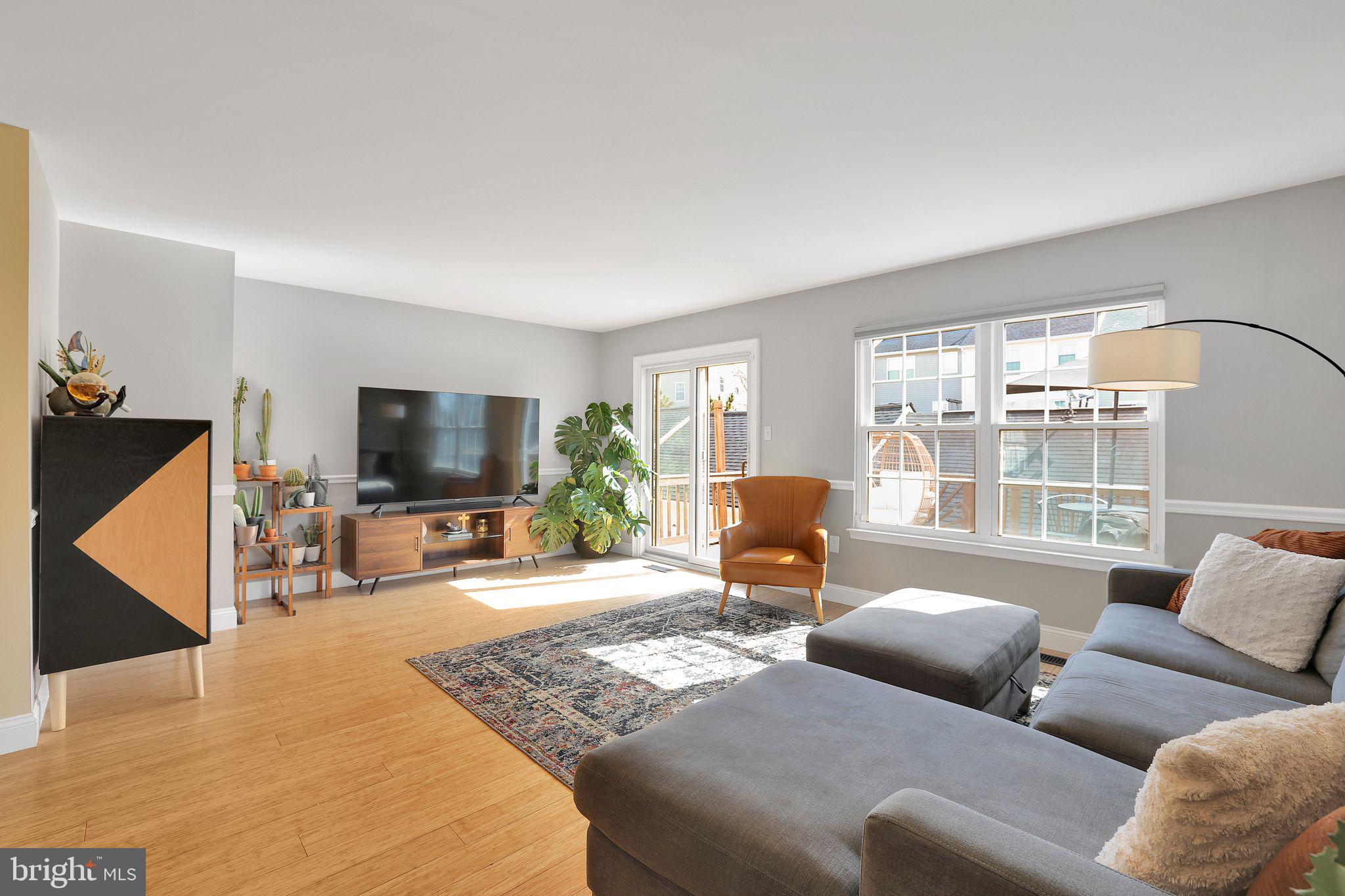 22952 Regent Terrace Sterling, VA 20166 - Photo 3 of 64 a living room with furniture and a flat screen tv