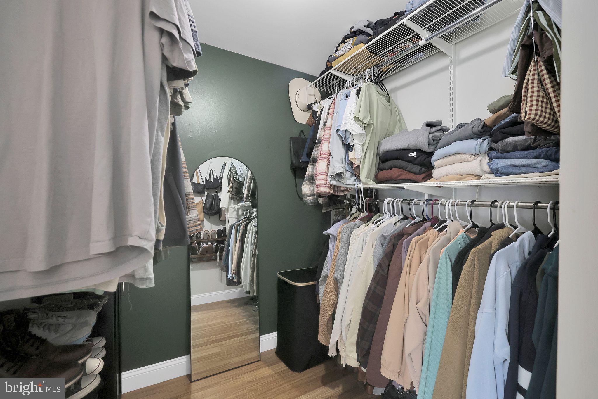22952 Regent Terrace Sterling, VA 20166 - Photo 31 of 64 a view of walk in closet with clothes and shoes
