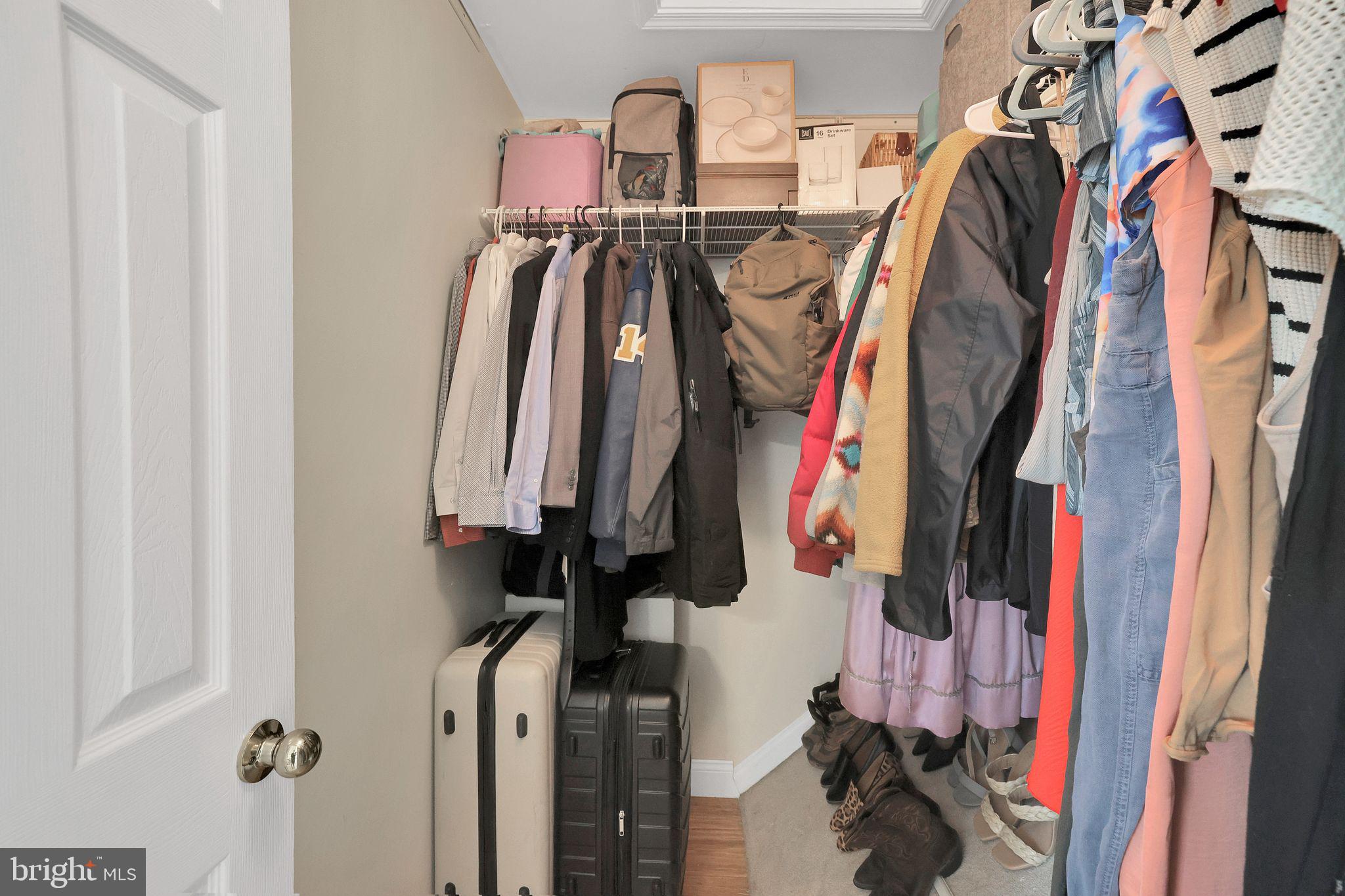22952 Regent Terrace Sterling, VA 20166 - Photo 38 of 64 a view of walk in closet with clothes and shoes