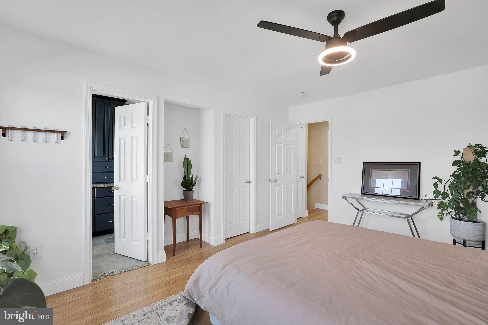 22952 Regent Terrace Sterling, VA 20166 - Photo 39 of 64 a bedroom with a bed and a large mirror on the dresser