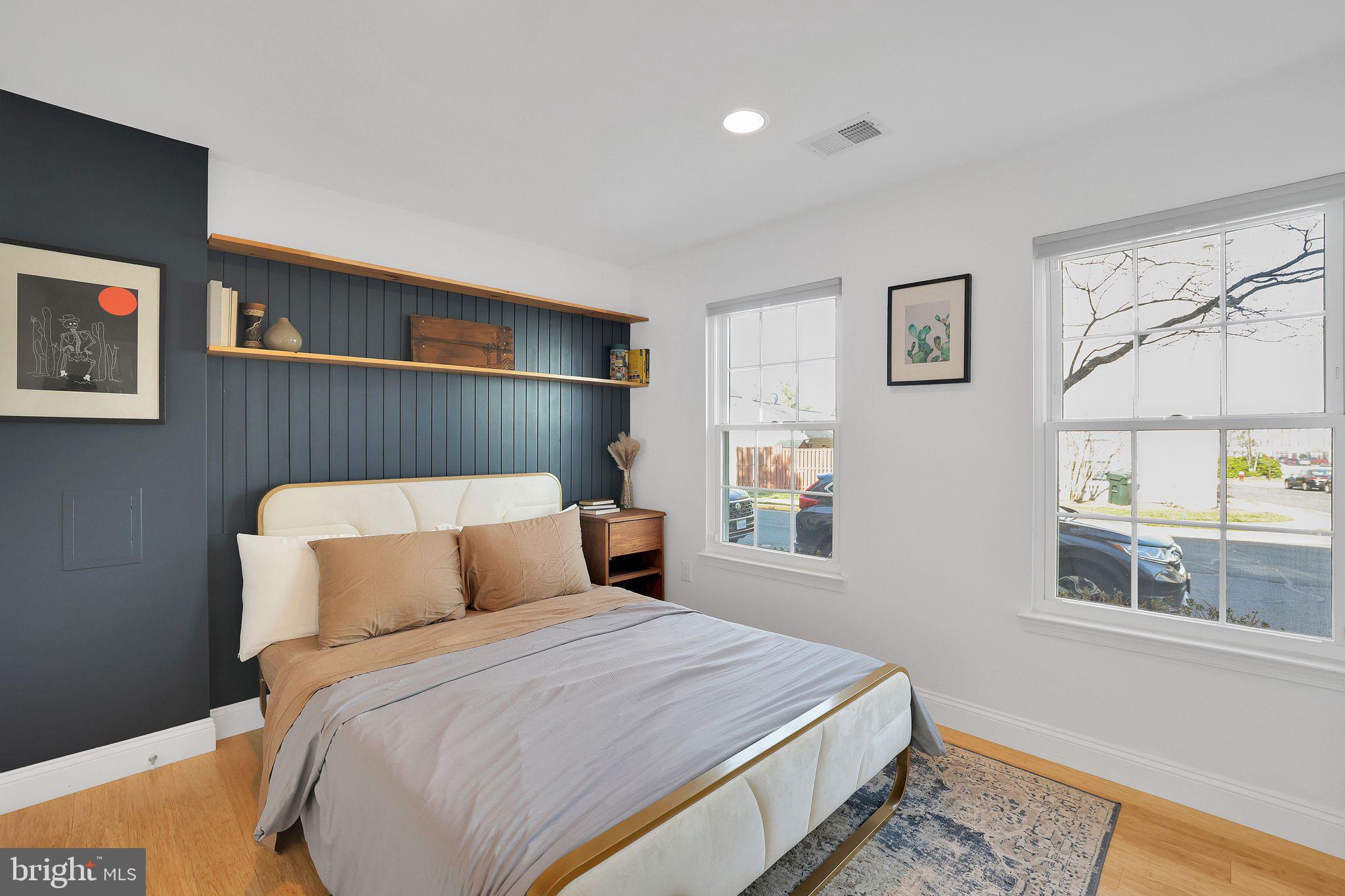 22952 Regent Terrace Sterling, VA 20166 - Photo 41 of 64 a bedroom with a large bed and a window