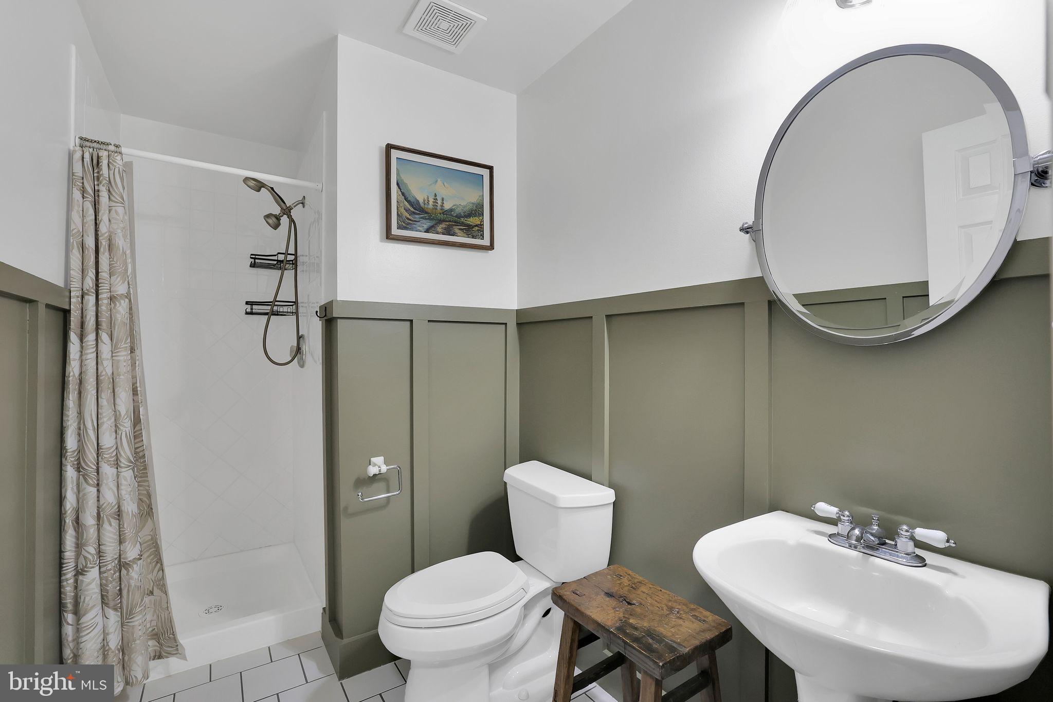 22952 Regent Terrace Sterling, VA 20166 - Photo 42 of 64 a bathroom with a toilet sink and mirror