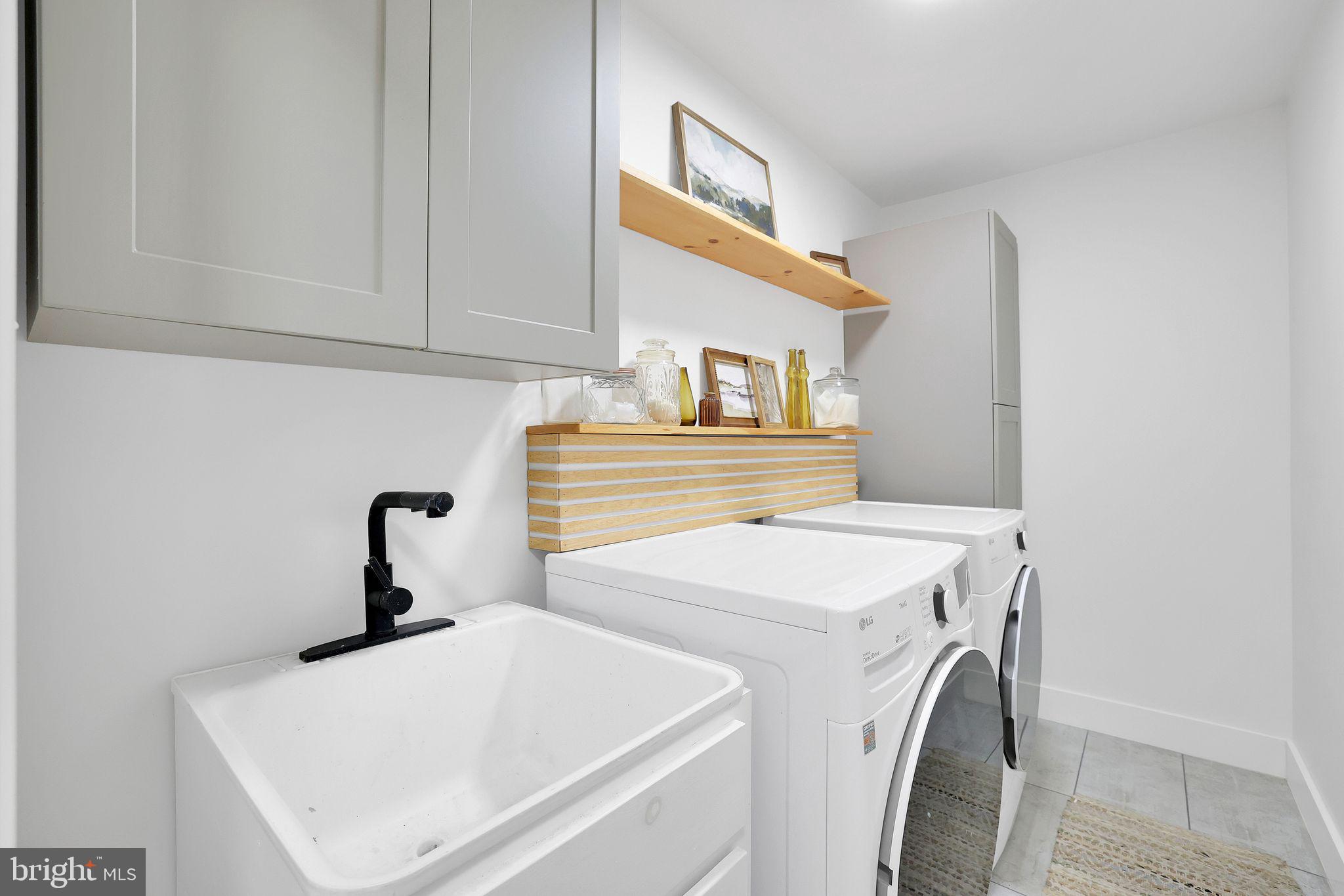 22952 Regent Terrace Sterling, VA 20166 - Photo 43 of 64 a utility room with dryer and washer