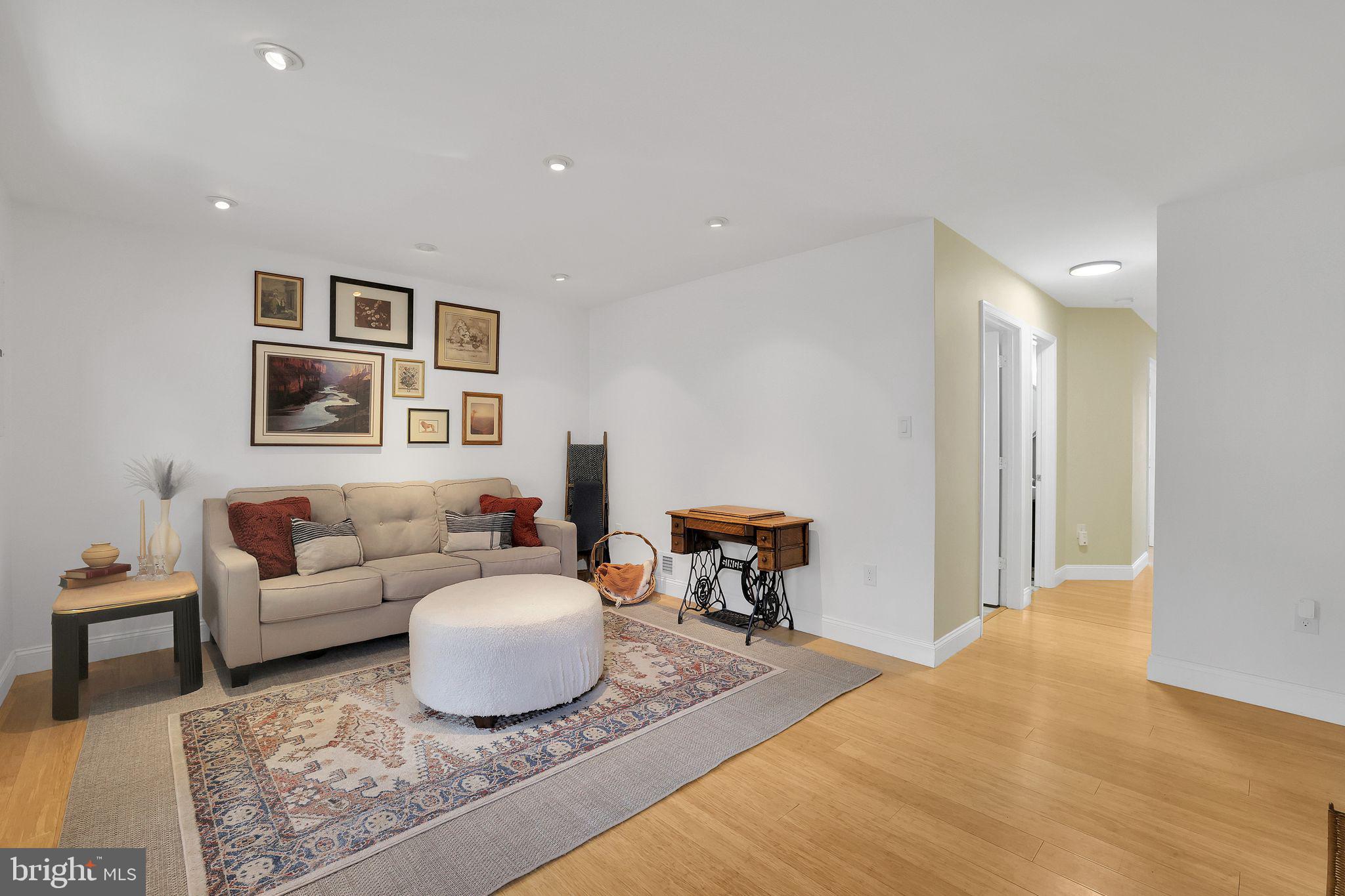 22952 Regent Terrace Sterling, VA 20166 - Photo 44 of 64 a living room with furniture and a table
