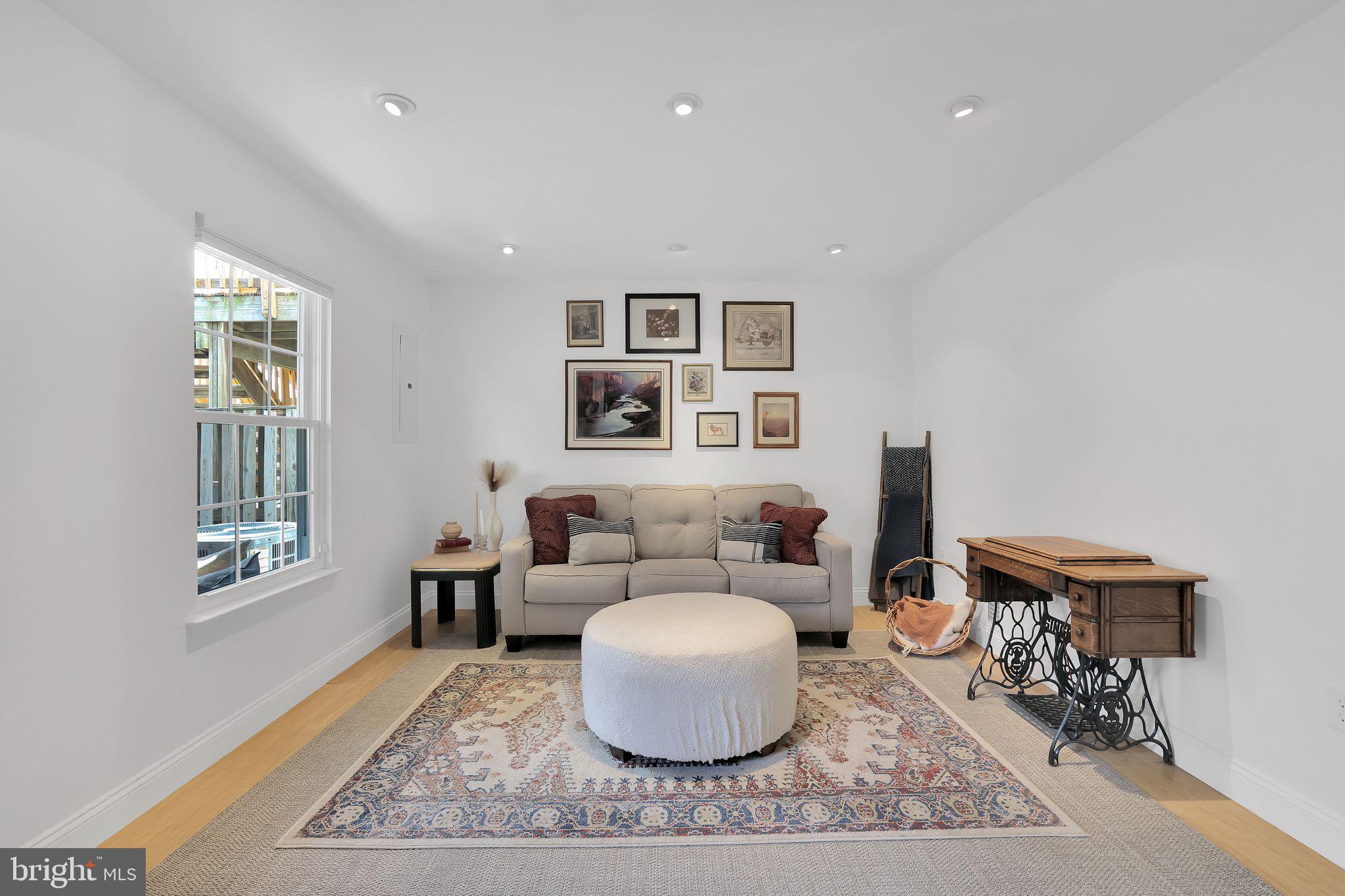 22952 Regent Terrace Sterling, VA 20166 - Photo 45 of 64 a living room with furniture and a window