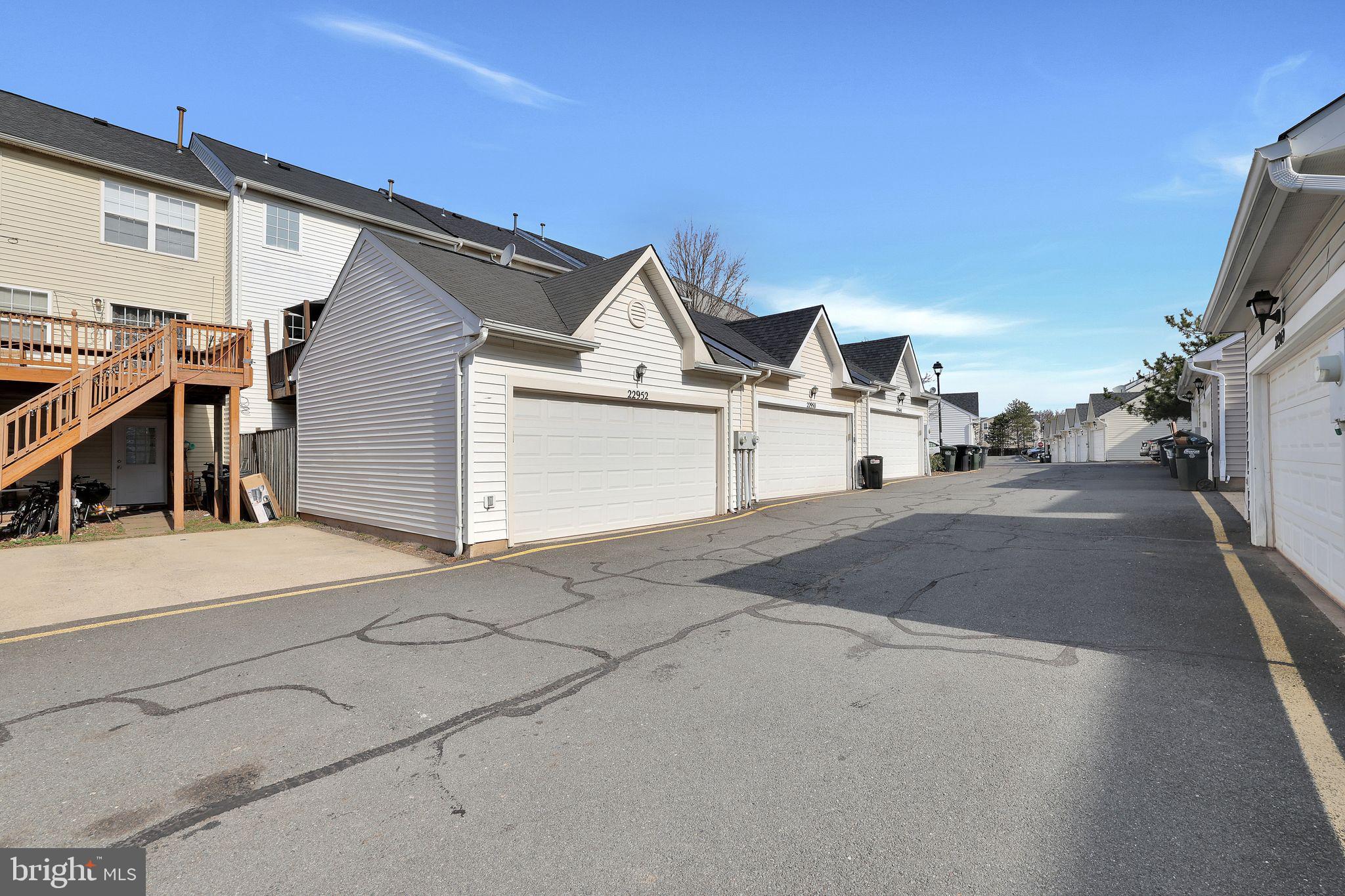 22952 Regent Terrace Sterling, VA 20166 - Photo 58 of 64 a view of a street with a house
