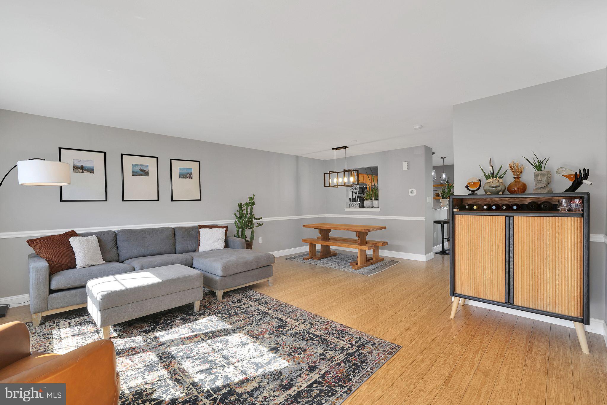 22952 Regent Terrace Sterling, VA 20166 - Photo 7 of 64 a living room with furniture and wooden floor