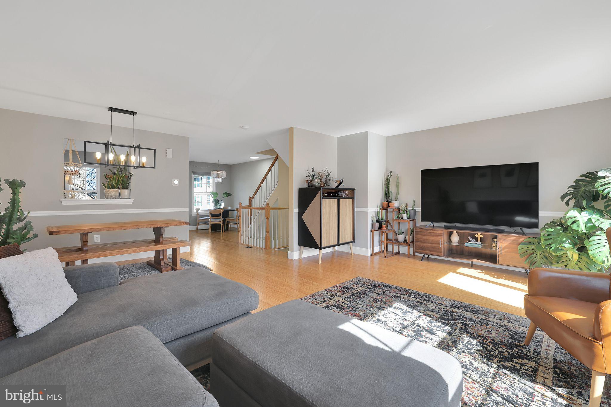 22952 Regent Terrace Sterling, VA 20166 - Photo 9 of 64 a living room with furniture and a flat screen tv