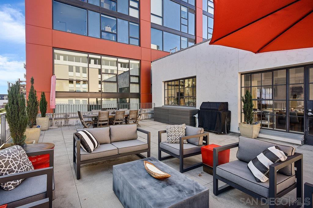 a building outdoor space with patio couches and a potted plant