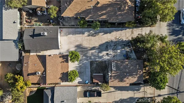 an aerial view of house with yard
