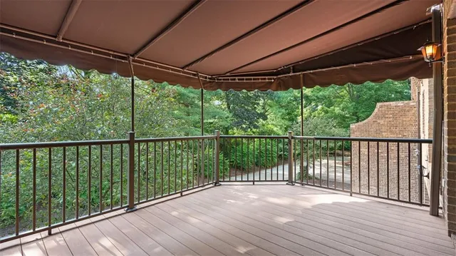 a view of a deck with wooden floor and outdoor space