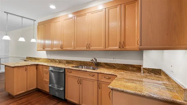 a kitchen with a sink and cabinets