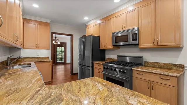 a kitchen with a refrigerator stove and microwave