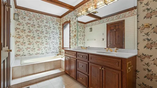 a bathroom with a granite countertop sink a toilet and a bathtub