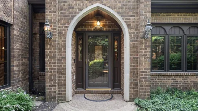 a view of building with glass windows and door