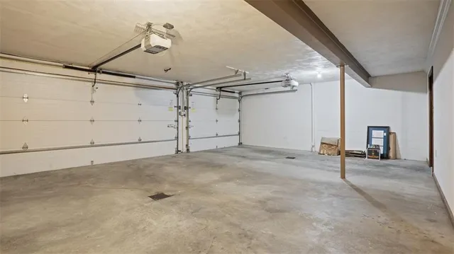 an aerial view of a house with pool outdoor seating and yard