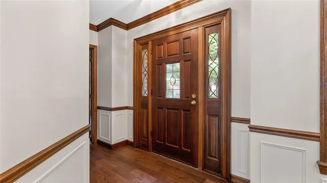 a view of front door with wooden floor