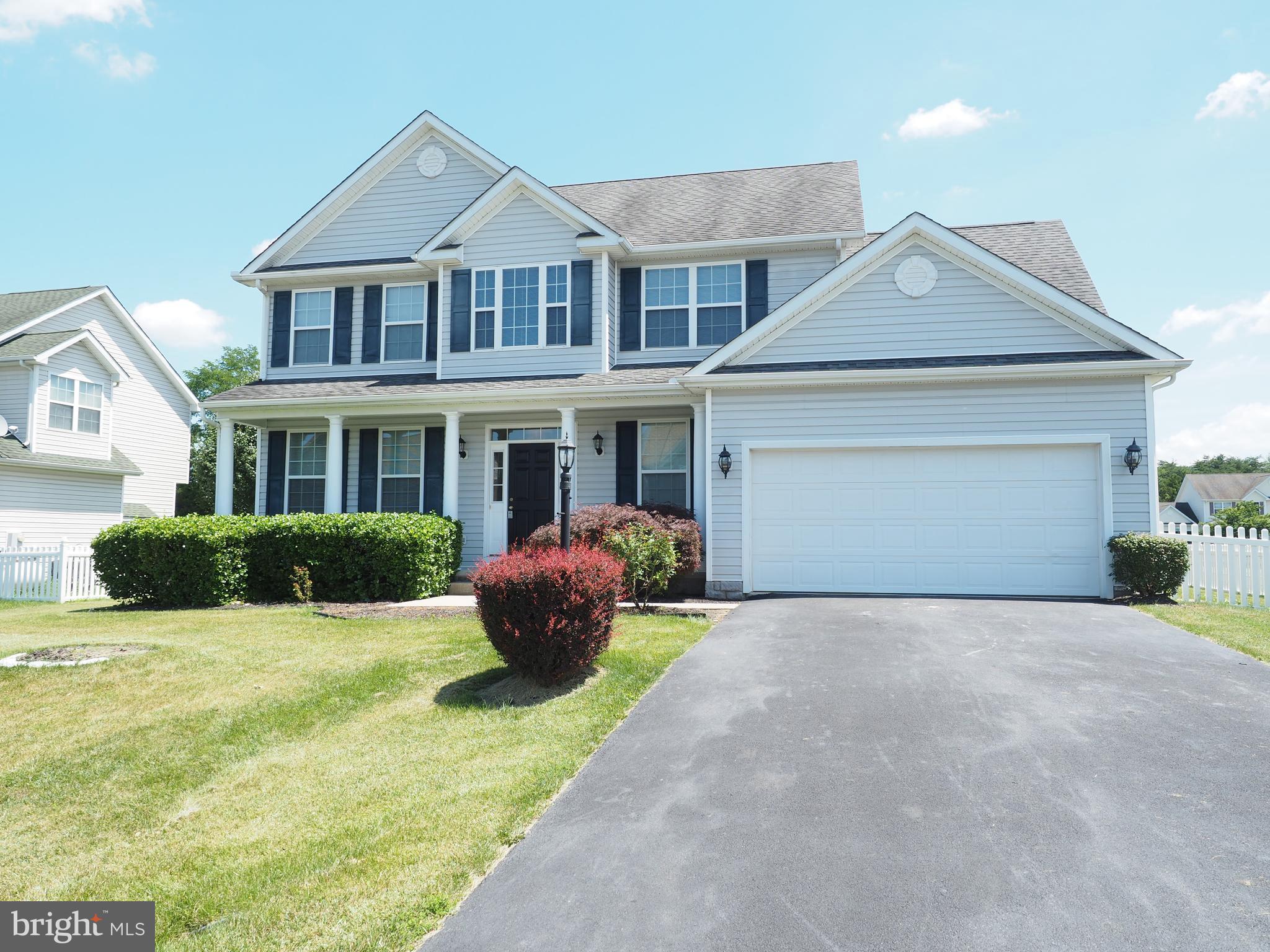 18 Solara Court Inwood, WV 25428 - Photo 2 of 24 a front view of a house with yard and glass windows