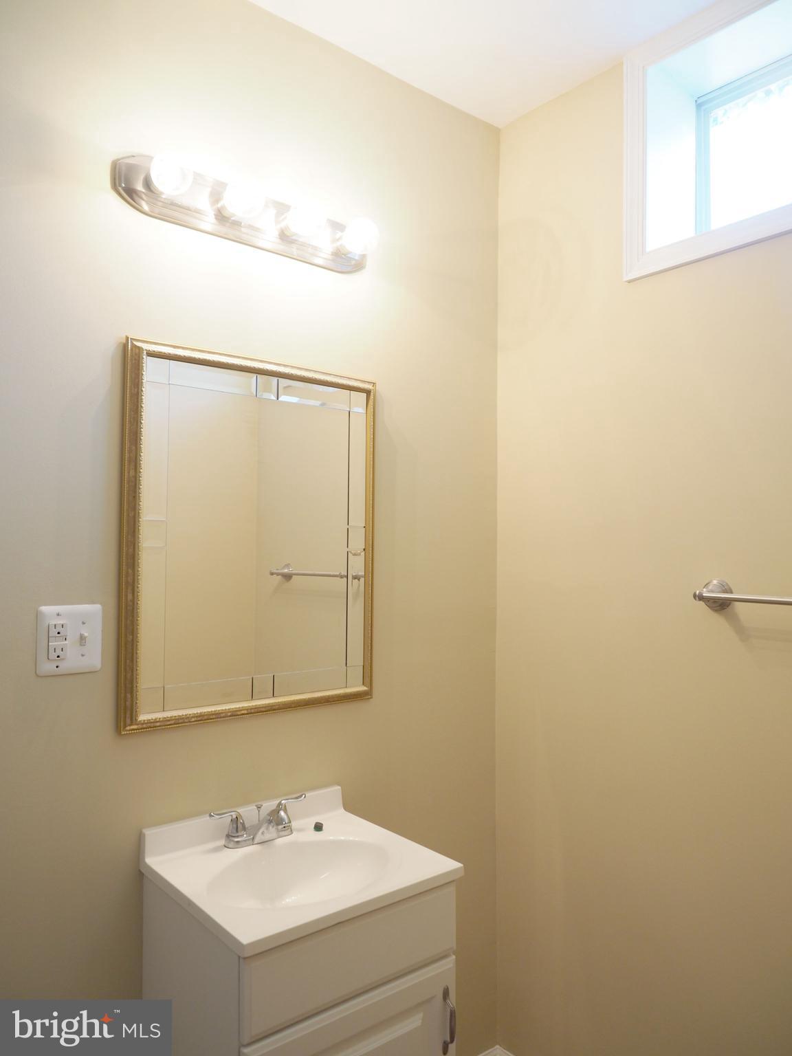18 Solara Court Inwood, WV 25428 - Photo 21 of 24 a bathroom with a sink and a mirror