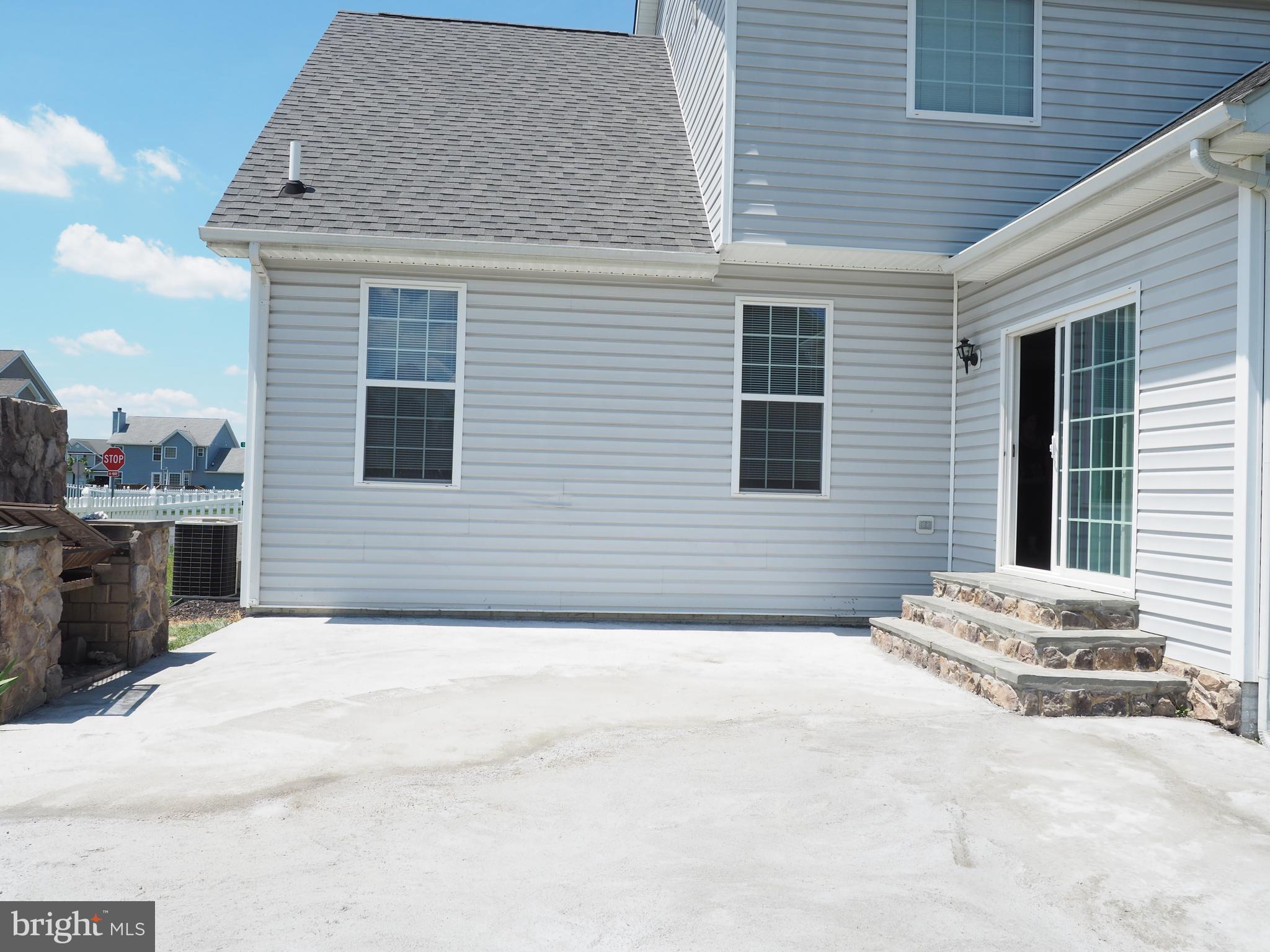 18 Solara Court Inwood, WV 25428 - Photo 23 of 24 a front view of a house with a garage